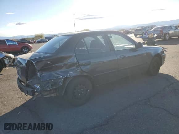 2005 Hyundai Accent GLS with VIN KMHCG45C95U665574, listed as a Copart auction lot 82603804 with 154,187 mi miles and Salvage title. Bid and sale history available at DreamBid. Image 3.