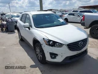 ✅ 2016 Mazda CX-5 Touring • VIN: JM3KE2CY0G0694939 • Lot: 43401057. Listed on IAAI with 125,867 mi. Free auction sales archive from the USA and detailed vehicle history report at DreamBid. Image 1.