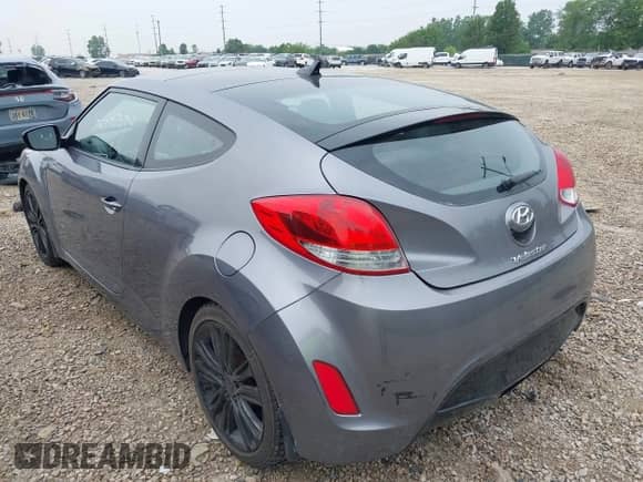 2012 Hyundai Veloster w/Gray Int z VIN KMHTC6ADXCU030284, wystawiony jako IAAI lot #42445394 z przebiegiem 156 536 mil mil oraz . Historia ofert i sprzedaży dostępna na DreamBid. Obrazek 6.