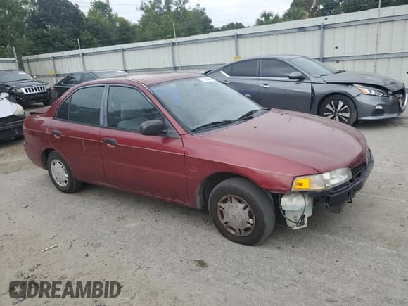 ✅ 1997 Mitsubishi Mirage DE • VIN: JA3AY26AXVU007285 • Lot: 71958454. Listed on Copart with 156,415 mi. Free auction sales archive from the USA and detailed vehicle history report at DreamBid. Image 4.