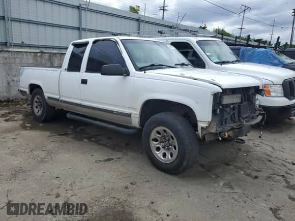 1999 Chevrolet Silverado 1500 with VIN 1GCEK19R2XR116510, listed as a Copart auction lot 50011045 with 174,401 mi miles and Salvage title. Bid and sale history available at DreamBid. Image 4.