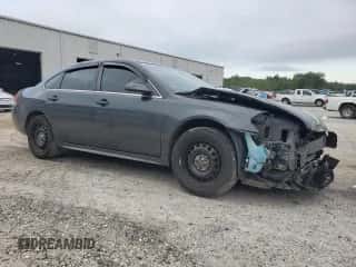 2015 Chevrolet Impala Police Police with VIN 2G1WD5E33F1132870, listed as a Copart auction lot 69433985 with 140,836 mi miles and Salvage title. Bid and sale history available at DreamBid. Image 4.