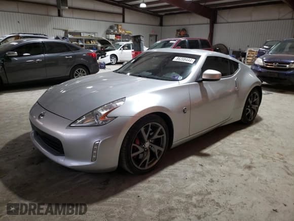 ✅ 2015 Nissan 370Z Nismo • VIN: JN1AZ4EH6FM440440 • Lot: 86208444. Listed on Copart with 106,945 mi. Free auction sales archive from the USA and detailed vehicle history report at DreamBid. Image 1.