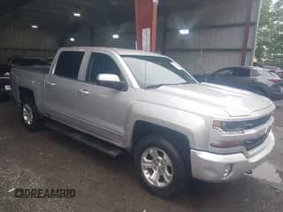 2018 Chevrolet Silverado 1500 LT z VIN 3GCUKREC2JG525366, wystawiony jako IAAI lot #43019515 z przebiegiem 166 139 mil mil oraz . Historia ofert i sprzedaży dostępna na DreamBid. Obrazek 1.