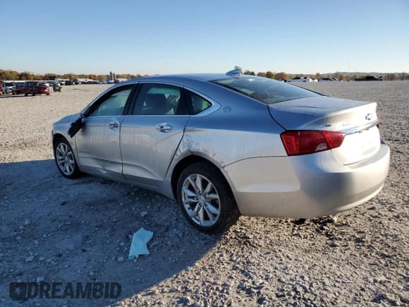 ✅ 2018 Chevrolet Impala LT • VIN: 1G1105SAXJU131477 • Lot: 89521875. Listed on Copart with 130,671 mi. Free auction sales archive from the USA and detailed vehicle history report at DreamBid. Image 2.