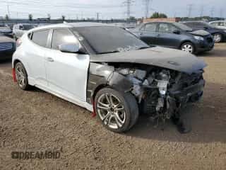 2013 Hyundai Veloster Turbo z VIN KMHTC6AE1DU126220, wystawiony jako Copart lot #71816384 z przebiegiem 128 943 mil mil oraz Szkoda całkowita • Salvage title. Historia ofert i sprzedaży dostępna na DreamBid. Obrazek 4.