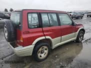 ✅ 1998 Suzuki Sidekick • VIN: JS3TD21VXW4103386 • Lot: 86219924. Listed on Copart with 172,959 mi. Free auction sales archive from the USA and detailed vehicle history report at DreamBid. Image 3.