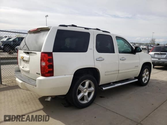 ✅ 2012 Chevrolet Tahoe LTZ • VIN: 1GNSCCE04CR213048 • Lot: 51284685. Listed on Copart with 192,733 mi. Free auction sales archive from the USA and detailed vehicle history report at DreamBid. Image 3.