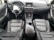 ✅ 2016 Mazda CX-5 Grand Touring • VIN: JM3KE4DY9G0666163 • Лот: 84364035. Опубликован ранее на Copart с пробегом 127 136 миль. Бесплатный доступ к архиву аукционных продаж из США и подробный отчёт об истории автомобиля на DreamBid. Изображение 8.