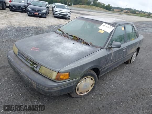 ✅ 1992 Mazda Protege • VIN: JM1BG2262N0508852 • Lot: 43184811. Listed on IAAI with 152,900 mi. Free auction sales archive from the USA and detailed vehicle history report at DreamBid. Image 2.