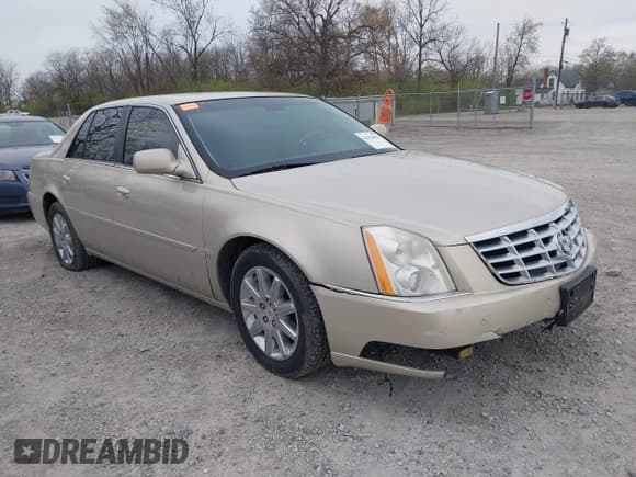 ✅ 2009 Cadillac DTS 1SA • VIN: 1G6KD57Y29U137410 • Lot: 42026044. Listed on IAAI with 112,916 mi. Free auction sales archive from the USA and detailed vehicle history report at DreamBid. Image 1.