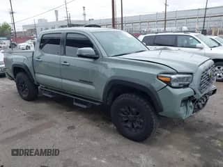 2022 Toyota Tacoma SR5 with VIN 3TMAZ5CN4NM165066, listed as a IAAI auction lot 42047534 with 68,920 mi miles and . Bid and sale history available at DreamBid. Image 1.
