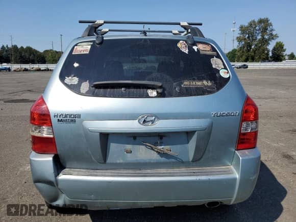 2009 Hyundai Tucson GLS z VIN KM8JM12B29U953176, wystawiony jako Copart lot #70141174 z przebiegiem 77 132 mil mil oraz Szkoda całkowita • Salvage title. Historia ofert i sprzedaży dostępna na DreamBid. Obrazek 6.