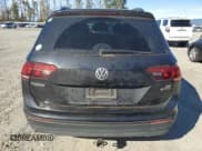 ✅ 2018 Volkswagen Tiguan S • VIN: 3VV0B7AX7JM083098 • Лот: 73700514. Опубликован ранее на Copart с пробегом 129 222 миль. Бесплатный доступ к архиву аукционных продаж из США и подробный отчёт об истории автомобиля на DreamBid. Изображение 6.