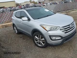 ✅ 2015 Hyundai Santa Fe • VIN: 5XYZW4LAXFG294009 • Lot: 43493851. Listed on IAAI with 89,481 mi. Free auction sales archive from the USA and detailed vehicle history report at DreamBid. Image 1.