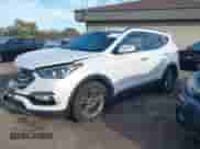 2018 Hyundai Santa Fe 2.4L z VIN 5NMZUDLB1JH097002, wystawiony jako IAAI lot #43473652 z przebiegiem 182 069 mil mil oraz . Historia ofert i sprzedaży dostępna na DreamBid. Obrazek 18.