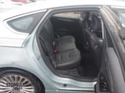 ✅ 2014 Ford Fusion Titanium Hybrid • VIN: 3FA6P0RU8ER350016 • Lot: 43532622. Listed on IAAI with 87,458 mi. Free auction sales archive from the USA and detailed vehicle history report at DreamBid. Image 8.