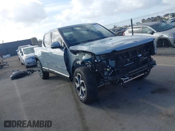 ✅ 2023 Rivian R1T Adventure • VIN: 7FCTGBAA6PN029019 • Lot: 43428333. Listed on IAAI with 13,983 mi. Free auction sales archive from the USA and detailed vehicle history report at DreamBid. Image 1.