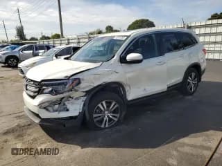 ✅ 2018 Honda Pilot EX-L • VIN: 5FNYF5H57JB023017 • Lot: 92241285. Listed on Copart with 117,496 mi. Free auction sales archive from the USA and detailed vehicle history report at DreamBid. Image 1.