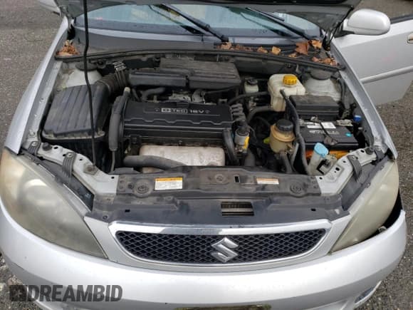 ✅ 2005 Suzuki Reno S • VIN: KL5JD66Z95K217050 • Лот: 86785194. Опубликован ранее на Copart с пробегом 77 614 миль. Бесплатный доступ к архиву аукционных продаж из США и подробный отчёт об истории автомобиля на DreamBid. Изображение 13.