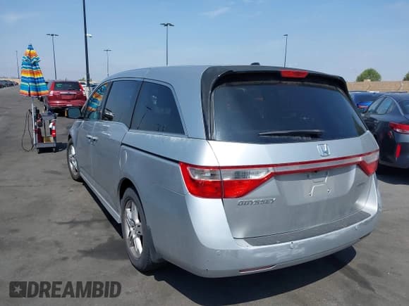 ✅ 2012 Honda Odyssey Touring • VIN: 5FNRL5H91CB004546 • Lot: 42175002. Listed on IAAI with 118,719 mi. Free auction sales archive from the USA and detailed vehicle history report at DreamBid. Image 3.