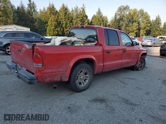 2003 Dodge Dakota Sport with VIN 1D7HL38XX3S275337, listed as a Copart auction lot 80963815 with 274,880 mi miles and Salvage title. Bid and sale history available at DreamBid. Image 3.