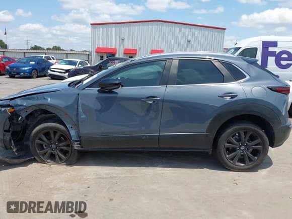 ✅ 2022 Mazda CX-30 S Carbon Edition • VIN: 3MVDMBCL6NM410330 • Lot: 42107426. Listed on IAAI with 30,277 mi. Free auction sales archive from the USA and detailed vehicle history report at DreamBid. Image 15.