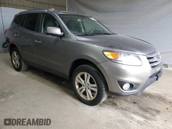 2012 Hyundai Santa Fe Limited с VIN 5XYZKDAG5CG144226, выставлен на аукционе Copart как лот 70772505 с пробегом 176 332 миль миль и Списание • Salvage title. История ставок и продаж доступна на DreamBid. Изображение 4.