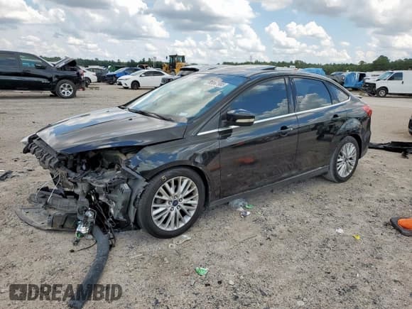 ✅ 2015 Ford Focus Titanium • VIN: 1FADP3J28FL386663 • Lot: 68867985. Listed on Copart with 77,154 mi. Free auction sales archive from the USA and detailed vehicle history report at DreamBid. Image 1.