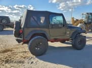 ✅ 2002 Jeep Wrangler Sahara • VIN: 1J4FA59SX2P739910 • Lot: 94188655. Listed on Copart with 109,888 mi. Free auction sales archive from the USA and detailed vehicle history report at DreamBid. Image 3.