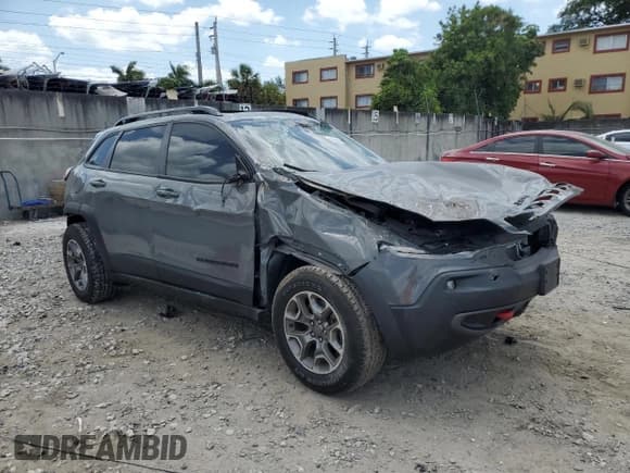 ✅ 2023 Jeep Cherokee Trailhawk • VIN: 1C4PJMBN7PD116214 • Lot: 55080845. Listed on Copart with 14,611 mi. Free auction sales archive from the USA and detailed vehicle history report at DreamBid. Image 4.