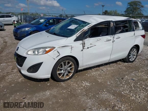 ✅ 2013 Mazda 5 Touring • VIN: JM1CW2CLXD0151396 • Lot: 40479013. Listed on IAAI with 118,314 mi. Free auction sales archive from the USA and detailed vehicle history report at DreamBid. Image 2.