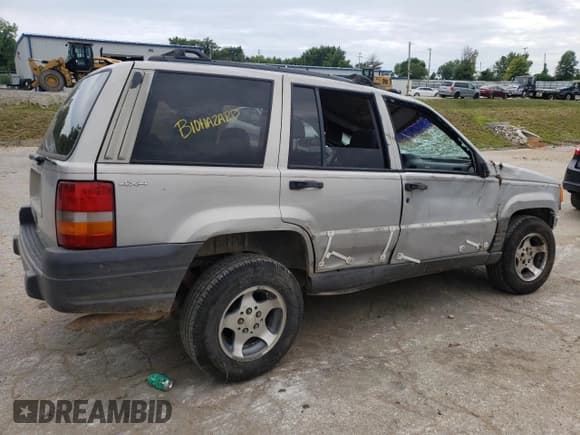 ✅ 1996 Jeep Grand Cherokee Laredo • VIN: 1J4GZ58S2TC401845 • Лот: 61013044. Опубликован ранее на Copart с пробегом Не указан. Бесплатный доступ к архиву аукционных продаж из США и подробный отчёт об истории автомобиля на DreamBid. Изображение 3.