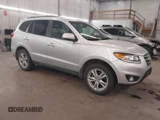 2012 Hyundai Santa Fe SE with VIN 5XYZHDAG5CG129742, listed as a IAAI auction lot 43241041 with 95,818 mi miles and . Bid and sale history available at DreamBid. Image 1.