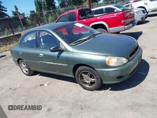 ✅ 2001 Kia Rio • VIN: KNADC123216081052 • Lot: 42854576. Listed on IAAI with 160,959 mi. Free auction sales archive from the USA and detailed vehicle history report at DreamBid. Image 1.
