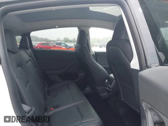 ✅ 2023 Tesla Model Y Long Range • VIN: 7SAYGDEE9PA069095 • Lot: 41986700. Listed on IAAI with 19,484 mi. Free auction sales archive from the USA and detailed vehicle history report at DreamBid. Image 8.