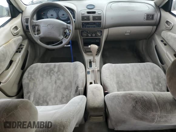 ✅ 1999 Toyota Corolla LE • VIN: 1NXBR12E6XZ148570 • Лот: 81554415. Опубликован ранее на Copart с пробегом 264 960 миль. Бесплатный доступ к архиву аукционных продаж из США и подробный отчёт об истории автомобиля на DreamBid. Изображение 8.