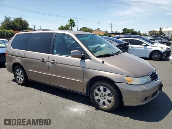 ✅ 2004 Honda Odyssey EX-L • VIN: 5FNRL18764B074729 • Lot: 66571035. Listed on Copart with 179,351 mi. Free auction sales archive from the USA and detailed vehicle history report at DreamBid. Image 4.