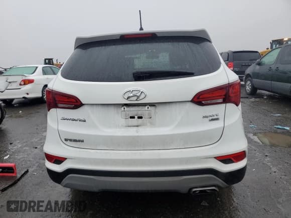 ✅ 2018 Hyundai Santa Fe 2.4L • VIN: 5XYZTDLB2JG563517 • Лот: 40059954. Опубликован ранее на Copart с пробегом 73 825 миль. Бесплатный доступ к архиву аукционных продаж из США и подробный отчёт об истории автомобиля на DreamBid. Изображение 6.
