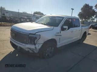 ✅ 2023 Ford F-150 Lightning Lariat • VIN: 1FTVW1EV0PWG12849 • Lot: 87083755. Listed on Copart with 35,557 mi. Free auction sales archive from the USA and detailed vehicle history report at DreamBid. Image 1.