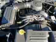 2003 Dodge Dakota Sport z VIN 1D7HL32X63S141658, wystawiony jako Copart lot #85207614 z przebiegiem 147 920 mil mil oraz Czysty tytuł • Clean title. Historia ofert i sprzedaży dostępna na DreamBid. Obrazek 13.