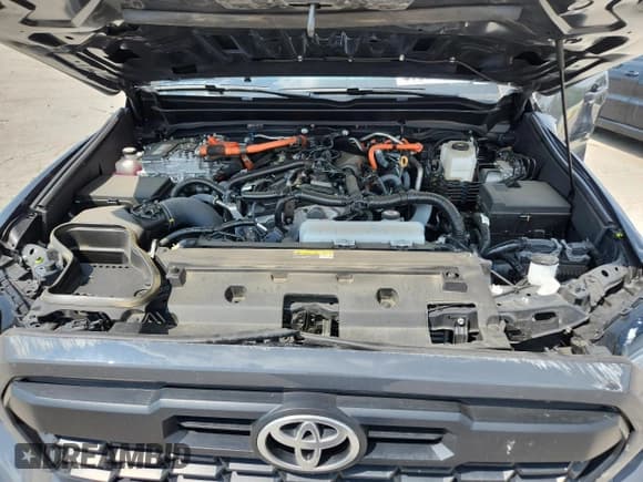 ✅ 2024 Toyota Tacoma TRD Sport Hybrid • VIN: 3TYLC5LN7RT003792 • Lot: 67003145. Listed on Copart with 18,487 mi. Free auction sales archive from the USA and detailed vehicle history report at DreamBid. Image 11.