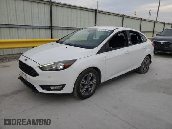 ✅ 2018 Ford Focus SE • VIN: 1FADP3FE7JL229119 • Lot: 87000115. Listed on Copart with 138,033 mi. Free auction sales archive from the USA and detailed vehicle history report at DreamBid. Image 1.