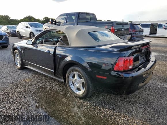 ✅ 2004 Ford Mustang Deluxe • VIN: 1FAFP44414F125267 • Lot: 74595714. Listed on Copart with Not provided. Free auction sales archive from the USA and detailed vehicle history report at DreamBid. Image 2.