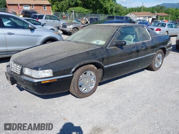 ✅ 2002 Cadillac Eldorado ESC • VIN: 1G6EL12Y52B105388 • Lot: 42423318. Listed on IAAI with 143,045 mi. Free auction sales archive from the USA and detailed vehicle history report at DreamBid. Image 2.