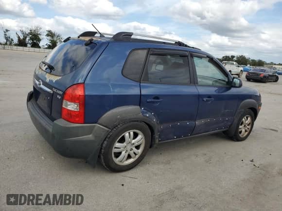 2006 Hyundai Tucson GLS z VIN KM8JN12D96U409834, wystawiony jako Copart lot #77131124 z przebiegiem 234 215 mil mil oraz Szkoda całkowita • Salvage title. Historia ofert i sprzedaży dostępna na DreamBid. Obrazek 3.