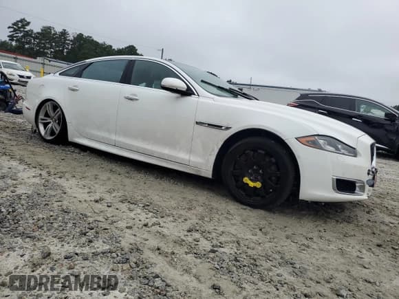 ✅ 2016 Jaguar XJ • VIN: SAJXA2EK1GMW02878 • Lot: 68632755. Listed on Copart with 95,851 mi. Free auction sales archive from the USA and detailed vehicle history report at DreamBid. Image 4.