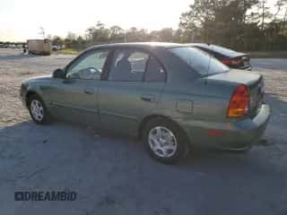 2005 Hyundai Accent GLS with VIN KMHCG45C35U595666, listed as a Copart auction lot 88294365 with 70,497 mi miles and Salvage title. Bid and sale history available at DreamBid. Image 2.