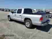 2004 Dodge Dakota SLT with VIN 1D7HL48K44S780575, listed as a Copart auction lot 57872335 with 148,785 mi miles and Salvage title. Bid and sale history available at DreamBid. Image 2.