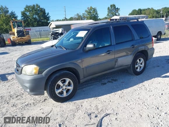✅ 2005 Mazda Tribute i • VIN: 4F2YZ02Z65KM48274 • Lot: 43129870. Listed on IAAI with 144,826 mi. Free auction sales archive from the USA and detailed vehicle history report at DreamBid. Image 2.